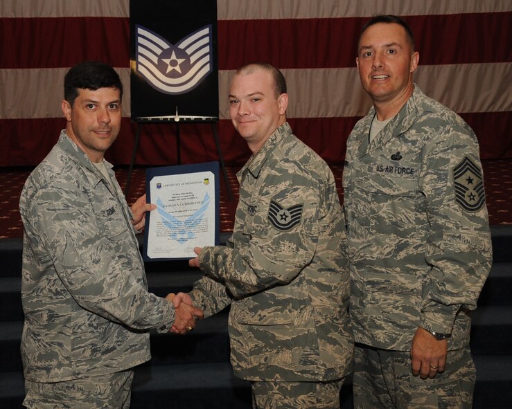 Staff Sgt. Nathan Cumberledge, 2nd Aircraft Maintenance Squadron, receives a certificate of promotion to Tech. Sgt. from Col. Andrew Gebara, 2nd Bomb Wing commander, during the March Wing Promotion Ceremony on Barksdale Air Force Base, La., April 1, 2013. (U.S. Air Force photo/Senior Airman Sean Martin)