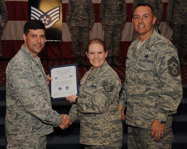 Senior Airman Tiffany Dickerson, 2nd Medical Support Squadron, receives a certificate of promotion to Staff Sgt. from Col. Andrew Gebara, 2nd Bomb Wing commander, during the March Wing Promotion Ceremony on Barksdale Air Force Base, La., April 1, 2013. (U.S. Air Force photo/Senior Airman Sean Martin)