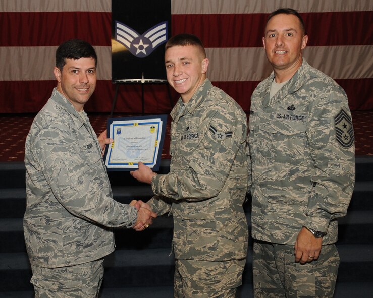 Airman 1st Class Jeffery Wilson, 2nd Aircraft Maintenance Squadron, receives a certificate of promotion to Senior Airman from Col. Andrew Gebara, 2nd Bomb Wing commander, during the March Wing Promotion Ceremony on Barksdale Air Force Base, La., April 1, 2013. (U.S. Air Force photo/Senior Airman Sean Martin)