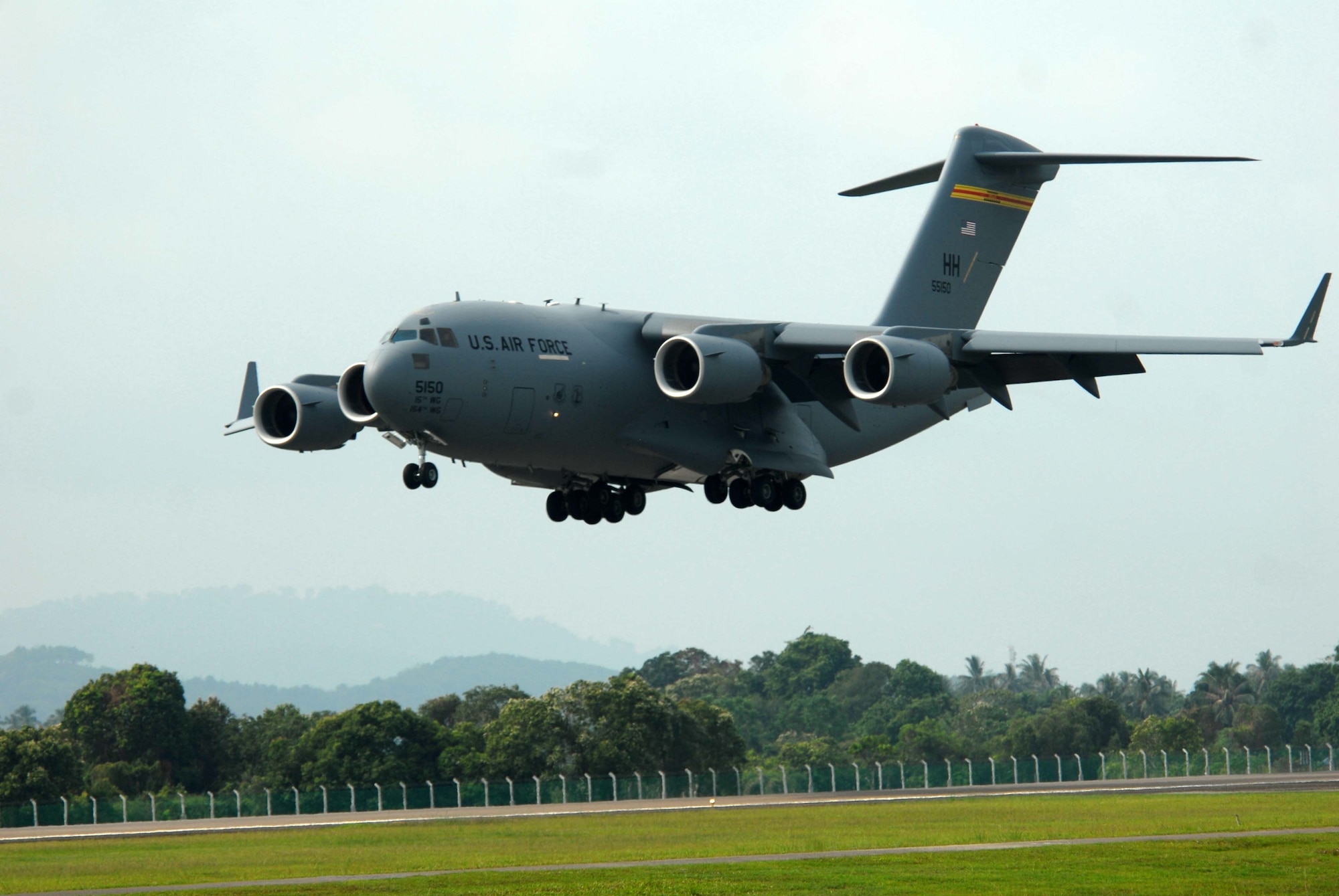 A C-17 Globemaster III of the U.S Air Force’s 535th Airlift Squadron prepares for a short-field landing demonstration during the 2013 Langkawi Interoperability Maritime and Aerospace Exhibition (LIMA 13) March 27, 2013, at Langkawi, Malaysia. Aircraft and personnel of the U.S. Navy and U.S. Air Force are supporting the 4-day exhibition and aerial demonstrations March 26-30. Events such as LIMA 13 help contribute to increased understanding and interoperability which supports region stability and security throughout the Indo-Asia-Pacific Region. (U.S. Navy photo/Mass Communication Specialist 1st Class Alfredo Rosado) 