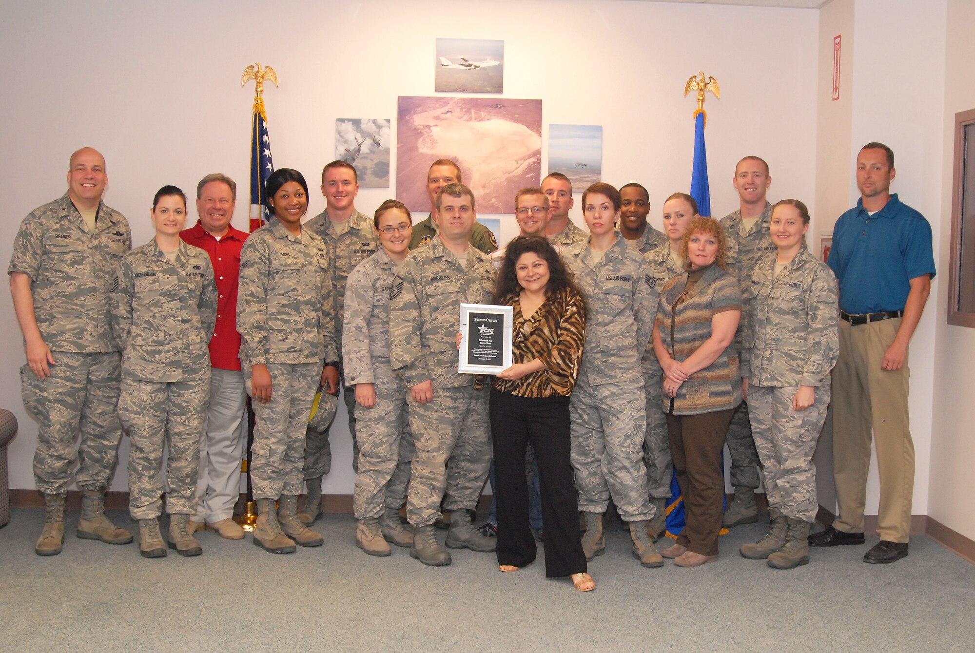 Members of Edwards AFB's 2012 Combined Federal Campaign team pose with the CFC Diamond Award April 1 at the 412th Test Wing headquarters building. Brig. Gen. Michael T. Brewer, 412th TW commander (far left), was presented the award and he then presented CFC Certificates of Appreciation to those Team Edwards members in attendance for their contributions to help make Edwards the most successful CFC fundraiser in Southern California.  (U.S. Air Force photo by Kenji Thuloweit) 