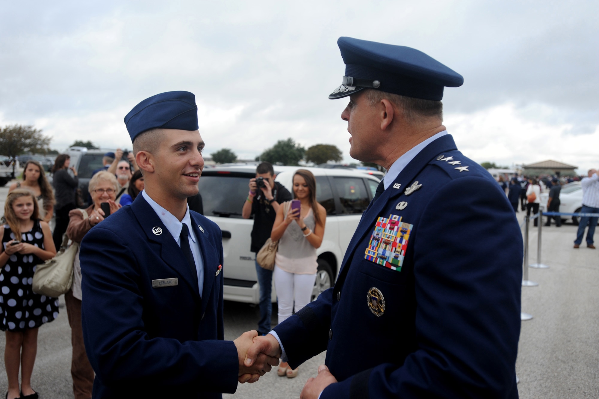 Lt. Gen. Frank Gorenc, Air Force assistant vice chief of staff and director of the Air Staff, congratulates AB Preston R. Leblanc on graduating from Air Force basic military training, at Joint Base San Antonio, TX, Nov. 2. Gen. Gorenc performed the duties of presiding officer at the Airman’s graduation. (U.S. Air Force photo by Tech. Sgt. Sarayuth Pinthong)