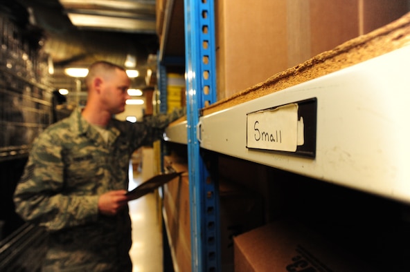 Tech. Sgt. Jeremy Sanford, 509th Security Forces Squadron NCOIC of supply, checks the serial numbers of cold-weather gear boxes during an inventory check at Whiteman Air Force Base, Mo., March 20. 2013. Sanford works alone in his office as the only enlisted person in charge of more than 5,000 security forces equipment items. (U.S. Air Force photo by Staff Sgt. Nick Wilson/Released)