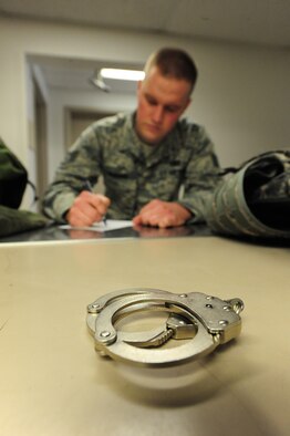 Staff Sgt. Travis Bledsoe, 509th Security Forces Squadron patrolman, signs a hand receipt after being issued new equipment from the SFS supply section at Whiteman Air Force Base, Mo., March 20, 2013. The 509th SFS supply section coordinates daily, weekly and yearly accountability supply reports to ensure security forces members have all the equipment needed to perform their jobs. (U.S. Air Force photo by Staff Sgt. Nick Wilson/Released)