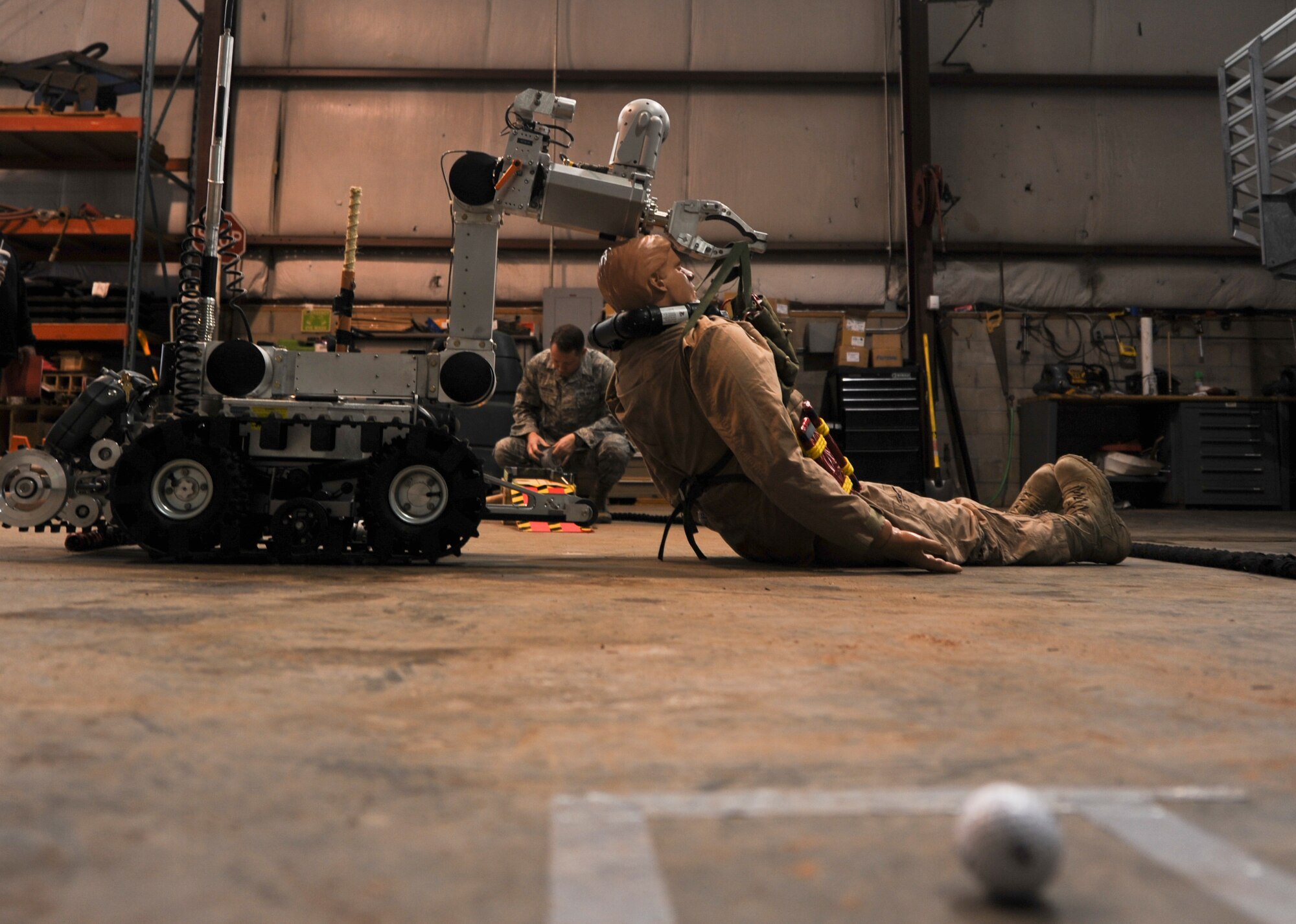 Tech Sgt. Wayson Leaverton, 21st Civil Engineer Squadron Explosive Ordnance Disposal technician, sets up the EOD mini golf course March 28 as part of a team-building exercise during Wingman Day, which allowed engineers to learn about the squadron’s various functions and the people who perform them. The 21st Space Wing held its Wingman Day to highlight the four pillars of wellness, which are physical, mental, social and spiritual fitness. (U.S. Air Force photo by Senior Airman Jacob Morgan)