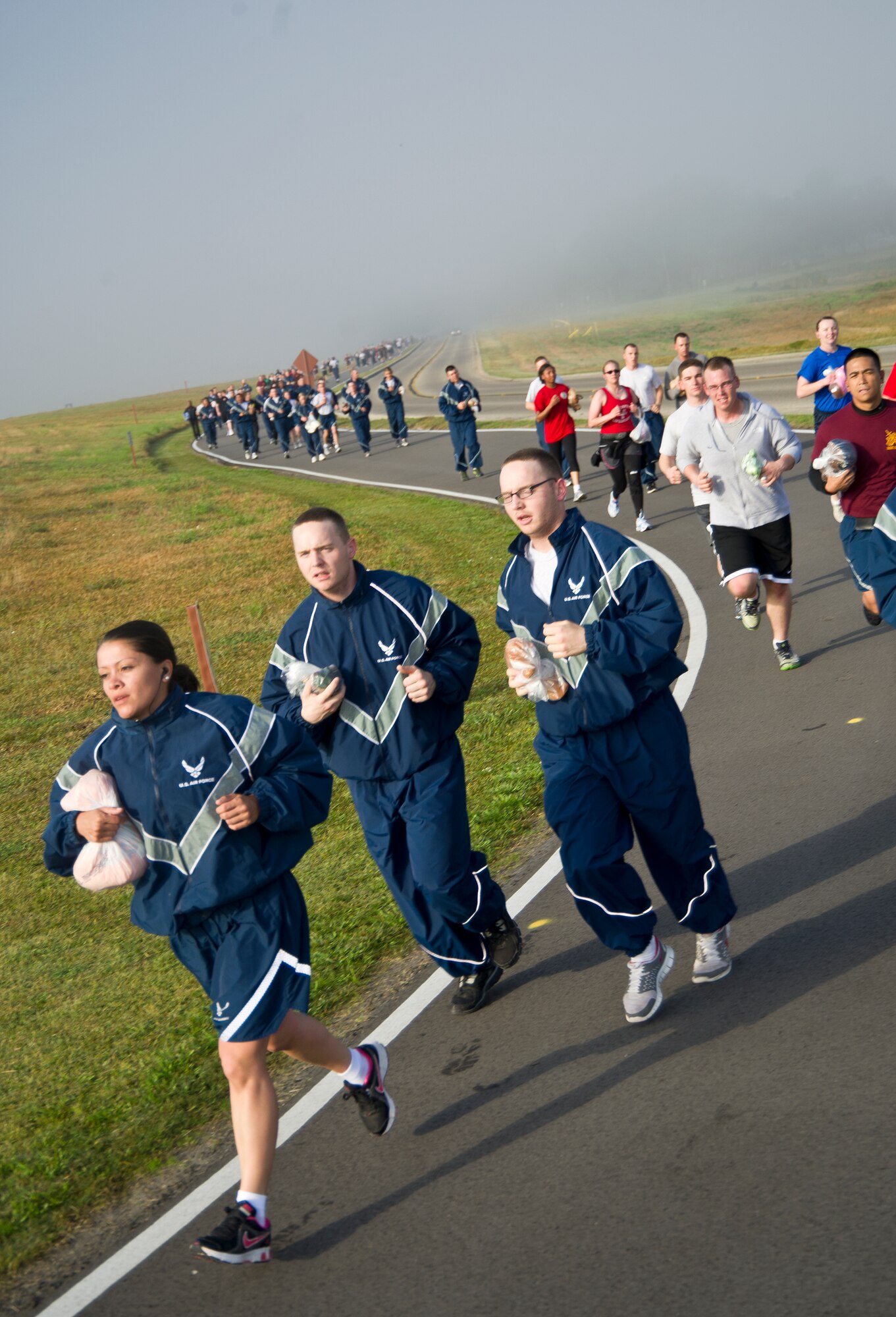 Runners in the 81st Training Group's Teddy Bear Run make their way around the I-81 track around the flightline March 29, 2013, at Keesler Air Force Base, Miss.  About 750 bears were donated for the run and will be passed on to children in crisis situations.  (U.S. Air Force photo by Adam Bond)