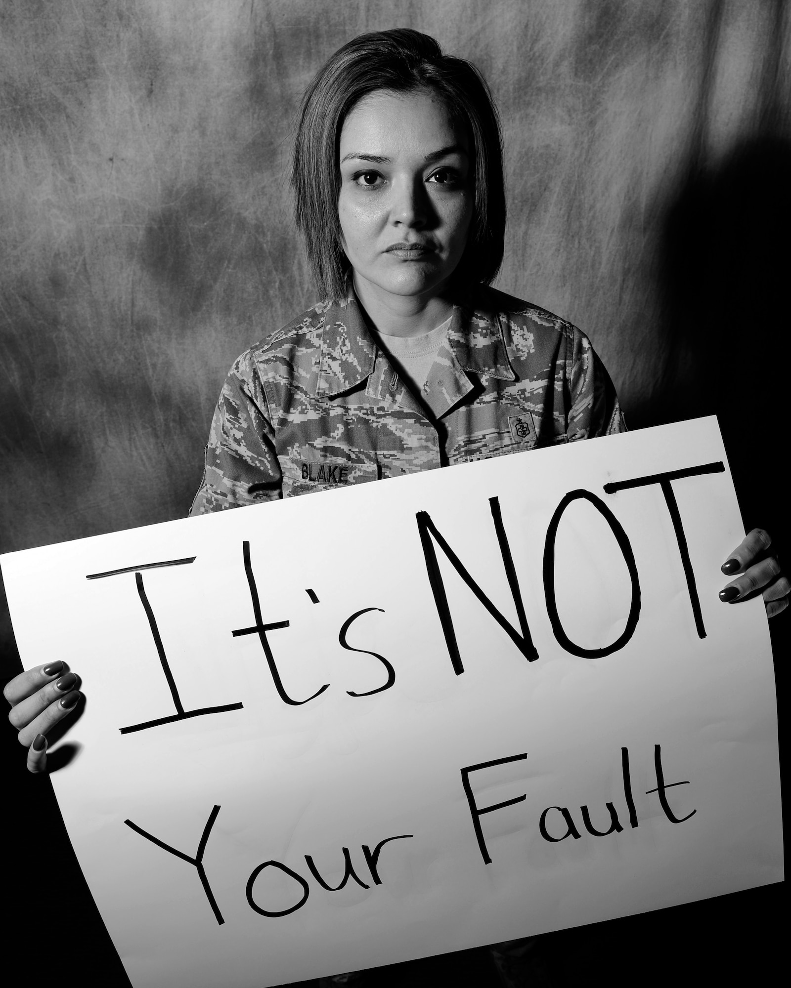 ROYAL AIR FORCE LAKENHEATH, England—Master Sgt. Michelle Blake, 48th Medical Group flight chief for medical readiness, sends a message to women, “It’s NOT your fault” April  2, 2013. Blake was a victim of sexual and domestic abuse and her story is being featured during Sexual Assault Awareness Month. (U.S. Air Force photo by Staff Sgt. Stephanie Mancha)