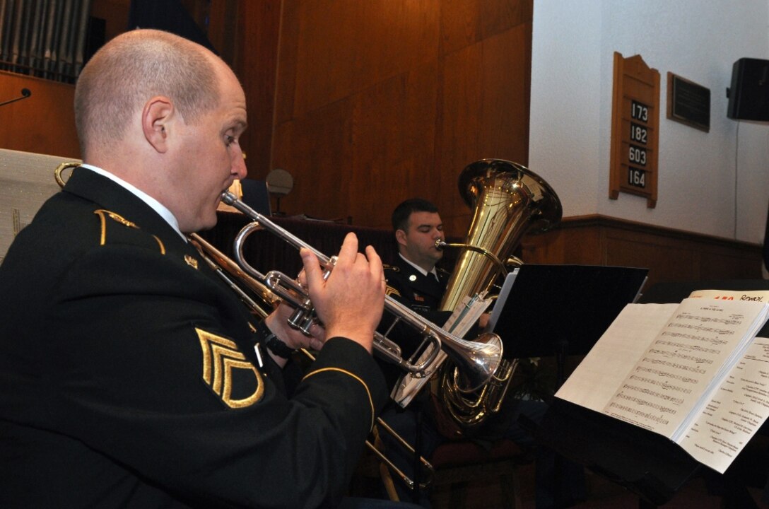 Soldiers from the U.S. Army Training and Doctrine Command Band Brass Quintet perform inspirational music during the post's Easter Sunrise Service at the Regimental Memorial Chapel at Fort Eustis, Va., March 31, 2013. More than 75 guests participated in the hour-long morning ceremony in celebration of the Easter holiday. (U.S. Air Force photo by Senior Airman Jason J. Brown/Released)