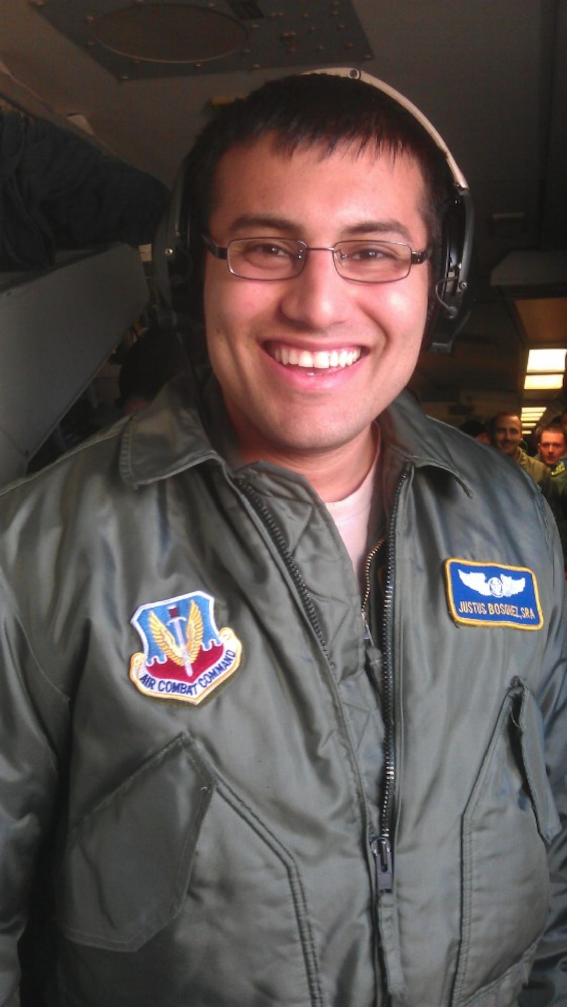 After receiving paperwork putting him back in flying status, Senior Airman Justus Bosquez took his first flight as an amputee March 25. The Airman, an E-3 air surveillance technician with the 965th Airborne Air Control Squadron, had his left leg amputated after a hit-and-run motorcycle accident in June 2011. (Courtesy photo) 