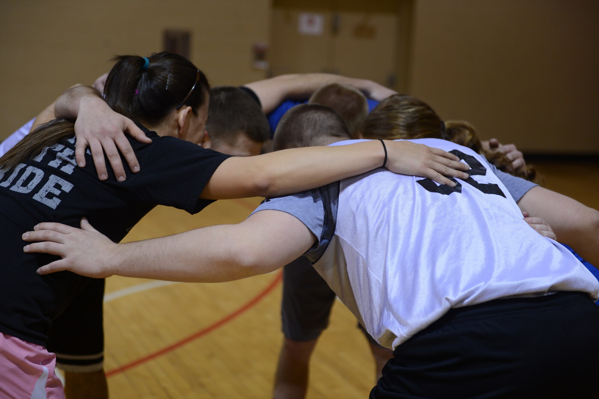 The 20th Component Maintenance Squadron’s volleyball team huddles during a timeout in the middle of a volleyball game at Shaw Air Force Base, S.C., March 28, 2013. The 20th CMS team is one of seven competing in Shaw’s intramural volleyball competition. The other six include 20th Force Support Squadron, Operations Support Squadron, Civil Engineering Squadron and Wing Staff Agencies; 28th Operational Weather Squadron; and Air Forces Central.  (U.S. Air Force photo by Airman 1st Class Krystal M. Jeffers/Released)