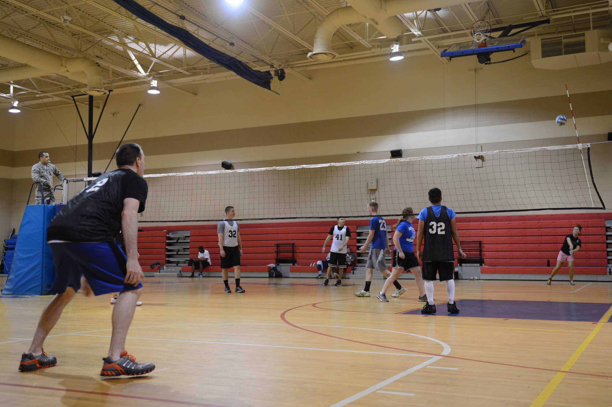 Alison Dorton, spouse of Senior Airmen Gregory Dorton, 20th Aircraft Maintenance Squadron, 77th Tigers Aircraft Maintenance Unit crew chief, and a member of the 20th Component Maintenance Squadron’s volleyball team, serves a ball to the Wing Staff Agency team during a volleyball game at Shaw Air Force Base, S.C., March 28, 2013. There are seven teams competing in Shaw’s intramural volleyball tournament. (U.S. Air Force photo by Airman 1st Class Krystal M. Jeffers/Released)