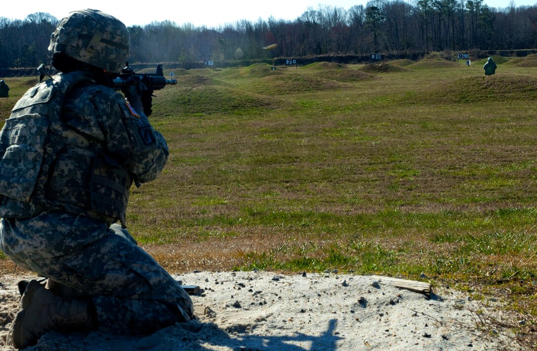 U.S. Army Sgt. 1st Class Tomekia Branch, 689th Rapid Port Opening Element distribution platoon sergeant, fires at a pop-up target on Range 3 during the marksmanship portion of the 597th Transportation Brigade’s annual Best Warrior Completion at Fort Eustis, Va., March 27, 2013. The rifle qualification portion of the week-long competition was one of many the eight competitors completed in hopes of being named the brigade’s best warrior. (U.S. Air Force photo by Airman 1st Class R. Alex Durbin/Released)
