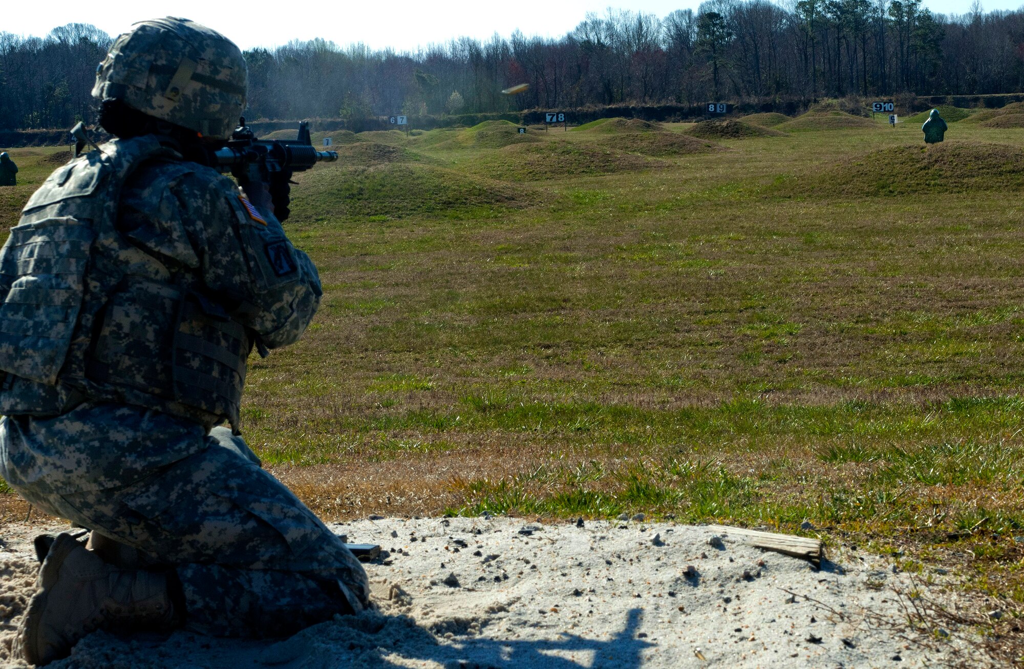 U.S. Army Sgt. 1st Class Tomekia Branch, 689th Rapid Port Opening Element distribution platoon sergeant, fires at a pop-up target on Range 3 during the marksmanship portion of the 597th Transportation Brigade’s annual Best Warrior Completion at Fort Eustis, Va., March 27, 2013. The rifle qualification portion of the week-long competition was one of many the eight competitors completed in hopes of being named the brigade’s best warrior. (U.S. Air Force photo by Airman 1st Class R. Alex Durbin/Released)
