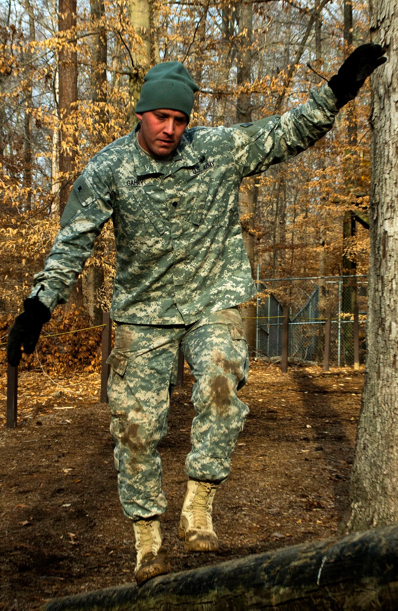 U.S. Army Spc. Carl Gahry, 689th Rapid Port Opening Element transportation management coordinator, carefully navigates a balancing log during the obstacle course portion of the 597th Transportation Brigade’s annual Best Warrior Competition at Fort Eustis, Va., March 28, 2013. The competing Soldiers navigated more than 10 obstacles throughout the course, testing their physical fitness. (U.S. Air Force photo by Airman 1st Class R. Alex Durbin/Released)