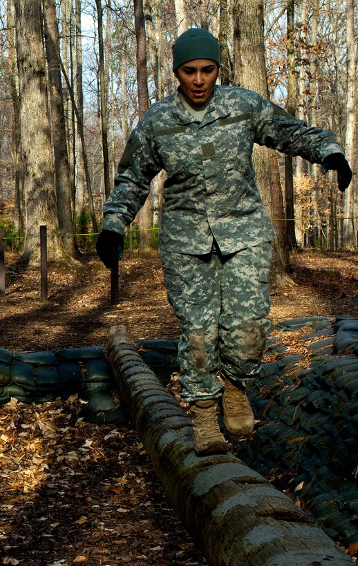 U.S. Army Sgt. Claribel Lopez Feliciano, 688th Rapid Port Opening Element management coordinator, walks across the balancing log during the obstacle course portion of the 597th Transportation Brigade’s annual Best Warrior Competition at Fort Eustis, Va., March 28, 2013. The obstacle course portion of the competition is meant to test the participants’ physical fitness and the skills need of all Soldiers on and off the battlefield.  (U.S. Air Force photo by Airman 1st Class R. Alex Durbin/Released)