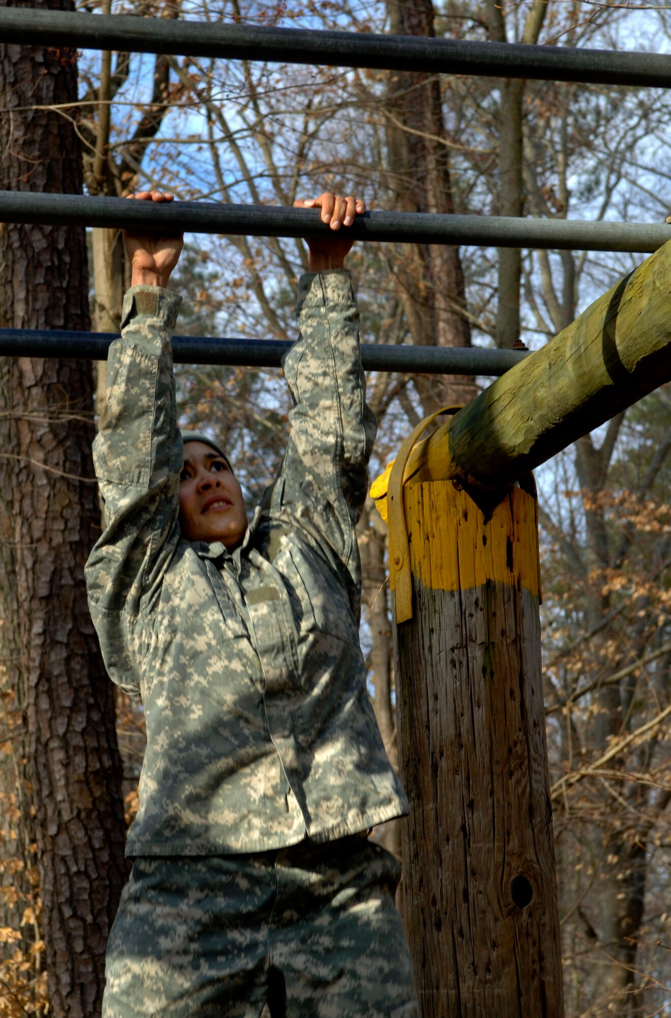 U.S. Army Sgt. Claribel Lopez Feliciano, 688th Rapid Port Opening Element transportation management coordinator, swings across the ladder obstacle during on the physical fitness portions of the 597th Transportation Brigade’s annual Best Warrior Competition March 28, 2013, at Fort Eustis, Va. Each Soldier traversed more than 10 obstacles to test their physical fitness and skills needed on and off the battlefield.  (U.S. Air Force photo by Airman 1st Class R. Alex Durbin/Released)