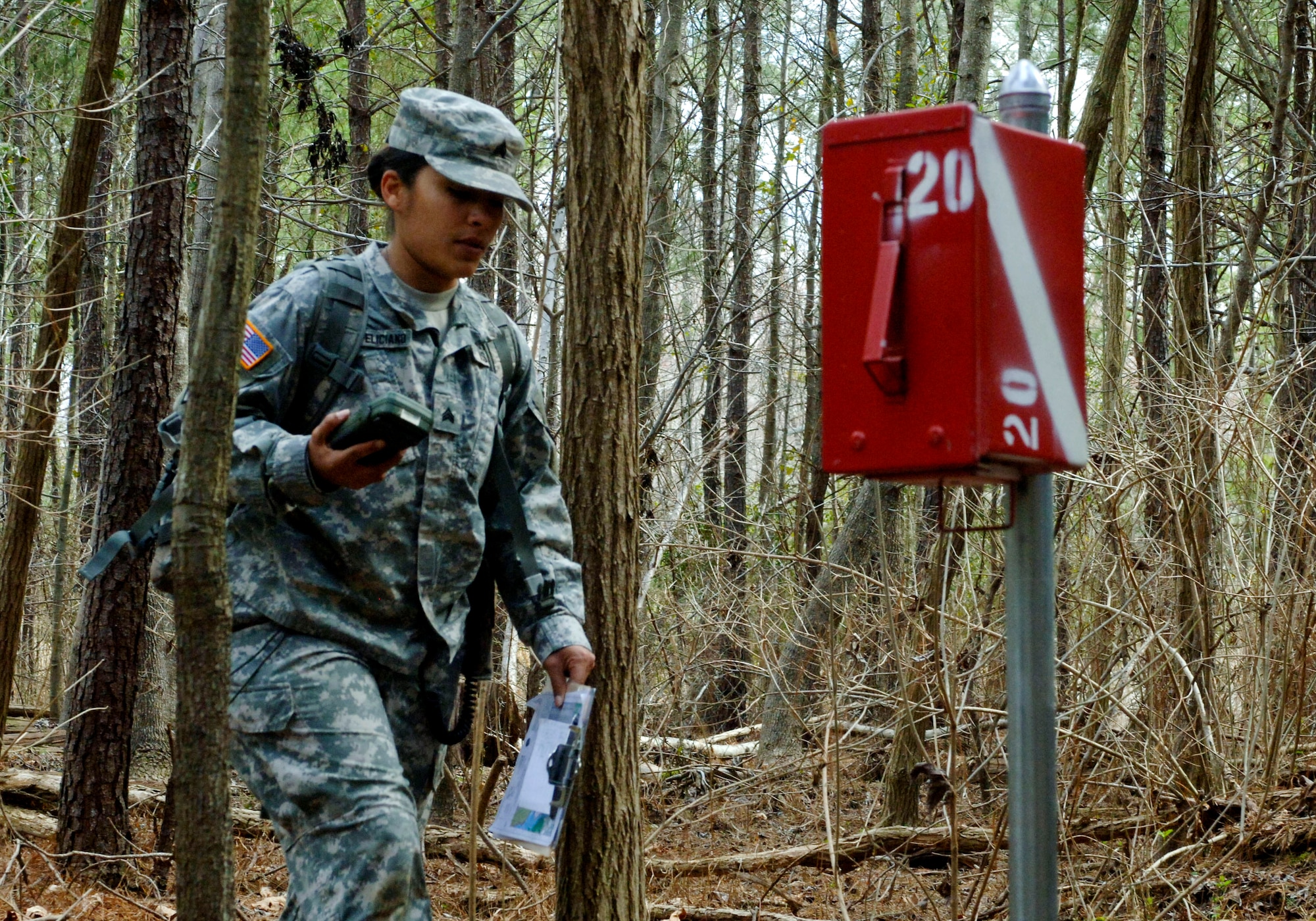 U.S. Army Sgt. Claribel Lopez Feliciano, 688th Rapid Port Opening Element transportation management coordinator, uses a Defense Advanced GPS Receiver to find the first of four geographical points during the land navigation portion of the 597th Transportation Brigade’s annual Best Warrior Competition. Before setting out to find their points, each Soldier used a map and coordinates to chart the location of each checkpoint. (U.S. Air Force photo by Airman 1st Class R. Alex Durbin/Released)
