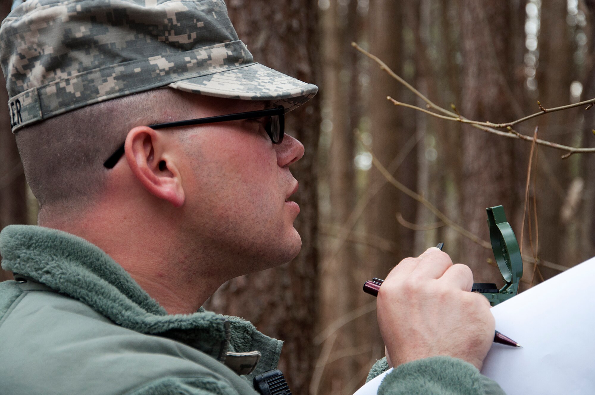 U.S. Army Spc. Timothy Butler, 688th Rapid Port Opening Element movement specialist, finds his course using a compass during the land navigation portion of the 597th Transportation Brigade’s annual Best Warrior Competition March 27, 2013 at Fort Eustis, Va. The even tested the ability of Soldiers use of a Defense Advanced GPS Receiver and compass, skills that can be used on and off the battlefield. (U.S. Air Force photo by Tech. Sgt. April Wickes/ RELEASED)