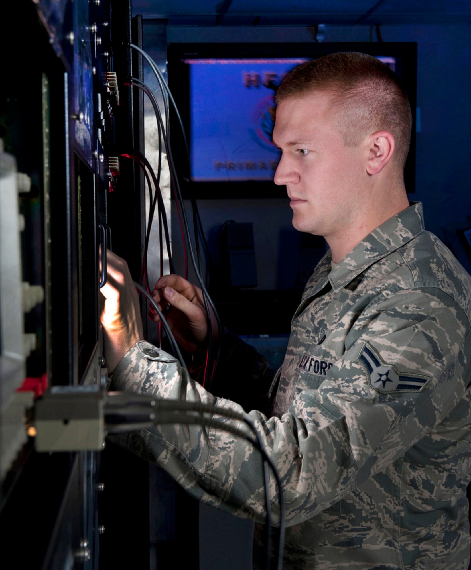 Airman 1st Class Matt Laughner monitors tones on a network system at Joint Base Andrews, Md. Laughner is a radio frequency transmissions system technician assigned to the 89th Communications Squadron/High Frequency Global Communications System section. (U.S. Air Force photo/Val Gempis)