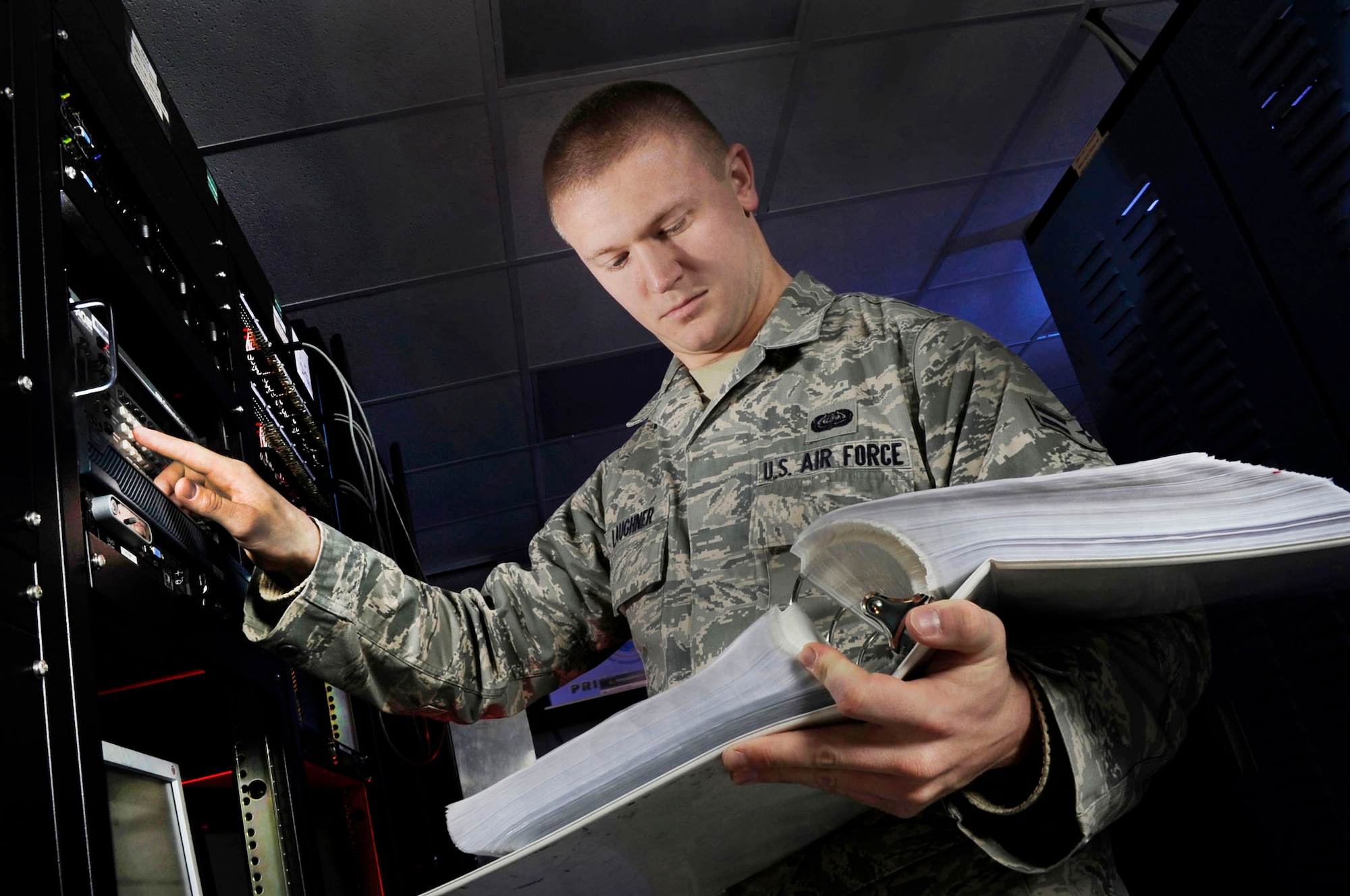 Airman 1st Class Matt Laughner performs vulnerability scans on a network system at Joint Base Andrews, Md.  Laughner is a radio frequency transmissions system technician assigned to the 89th Communications Squadron/High Frequency Global Communications System section. (U.S. Air Force photo/Val Gempis)