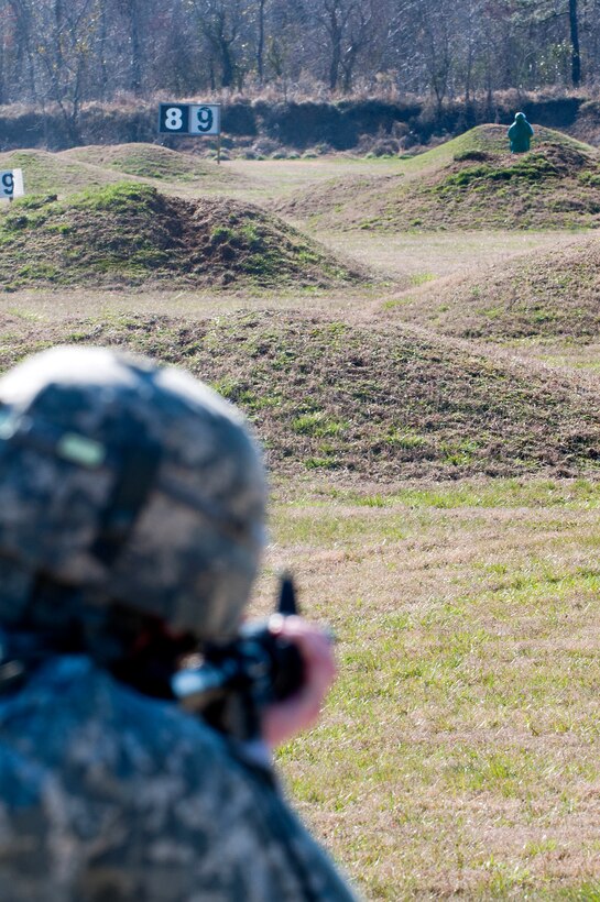 U.S. Army Spc. Carl Gahry, 689th Rapid Port Opening Element transportation management coordinator, fires at a target at Range Three during the rifle qualification portion of the 597th Transportation Brigade’s annual Best Warrior Competition March 27, 2013 at Fort Eustis, Va. This portion of the week long competition tested the marksmanship skills of the eight competitors. (U.S. Air Force photo by Tech. Sgt. April Wickes /RELEASED)