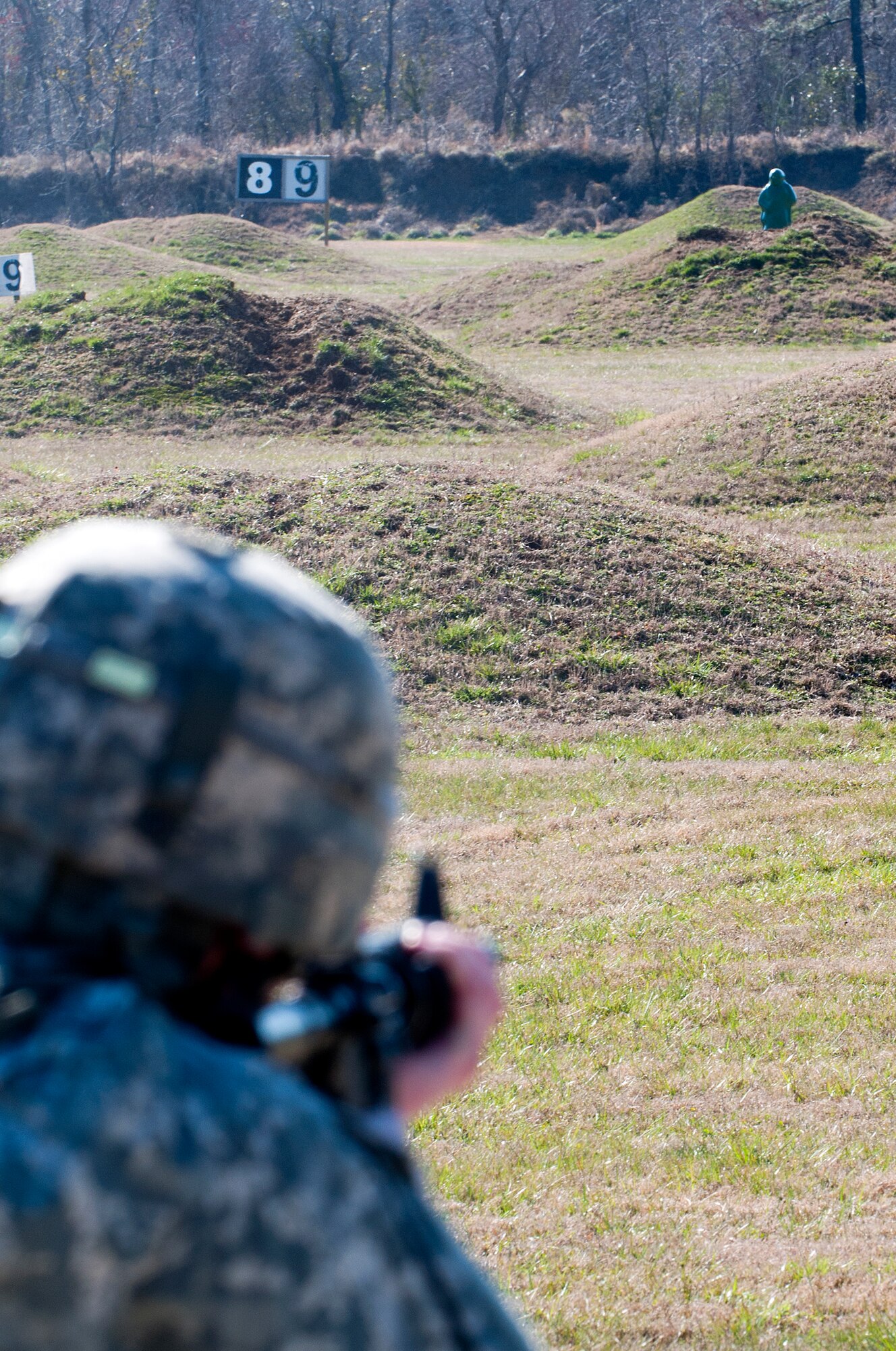 U.S. Army Spc. Carl Gahry, 689th Rapid Port Opening Element transportation management coordinator, fires at a target at Range Three during the rifle qualification portion of the 597th Transportation Brigade’s annual Best Warrior Competition March 27, 2013 at Fort Eustis, Va. This portion of the week long competition tested the marksmanship skills of the eight competitors. (U.S. Air Force photo by Tech. Sgt. April Wickes /RELEASED)