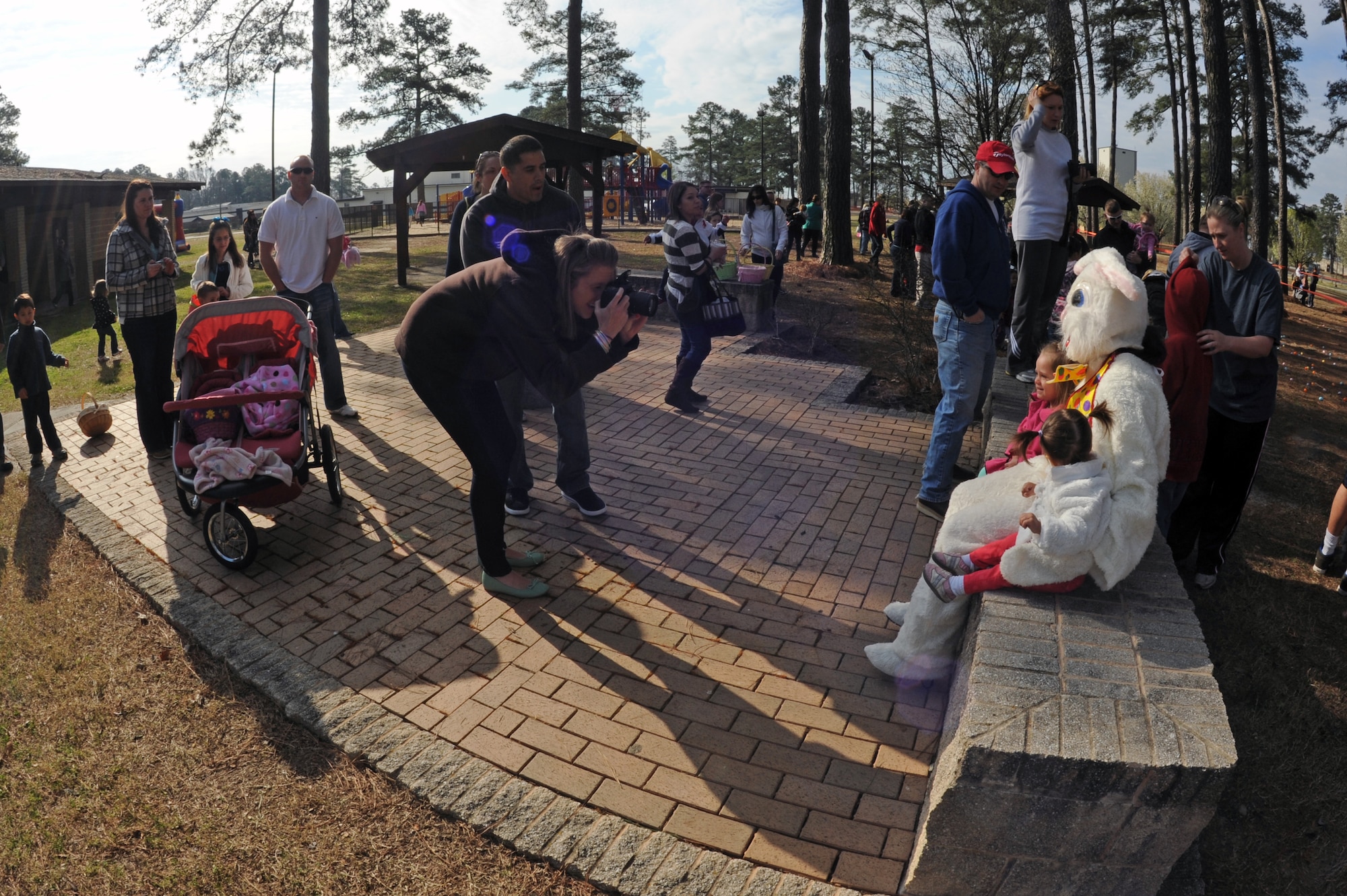 The Easter Bunny poses for photos with children during the Easter Egg Hunt event at Debden Park on Seymour Johnson Air Force Base, N.C., Mar. 30, 2013. The 4th Force Support Squadron community center coordinated a variety of events to follow the Easter Egg Hunt, such as a cakewalk, a bounce castle and group photos with the Easter Bunny. (U.S. Air Force photo/Airman 1st Class John Nieves Camacho/Released)