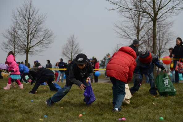 SPANGDAHLEM AIR BASE, Germany – Children hunt for plastic eggs in a field outside Club Eifel during an Easter celebration as part of the Month of the Military Child March 30, 2013. Commands are encouraged to plan appropriate activities that will focus attention on issues concerning children and the military community’s responsibility toward them throughout the month. Children up to age 13 participated in Easter egg hunts throughout the day. (U.S. Air Force photo by Airman 1st Class Gustavo Castillo/Released)