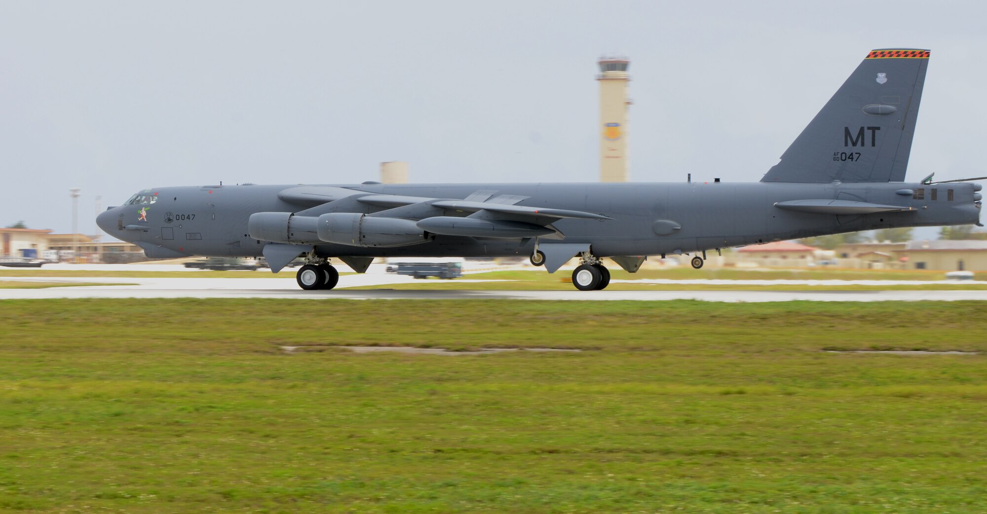 A B-52 Stratofortress from the 23rd Expeditionary Bomb Squadron, deployed from Minot Air Force Base, N.D., lands at Andersen AFB, Guam, April 2, 2013. The 23rd EBS arrived March 31 in relief of the 96th EBS from Barksdale AFB, La. and is deployed to Andersen to support U.S. Pacific Command’s continuous bomber presence mission.  (U.S. Air Force photo by Senior Airman Benjamin Wiseman/Released)