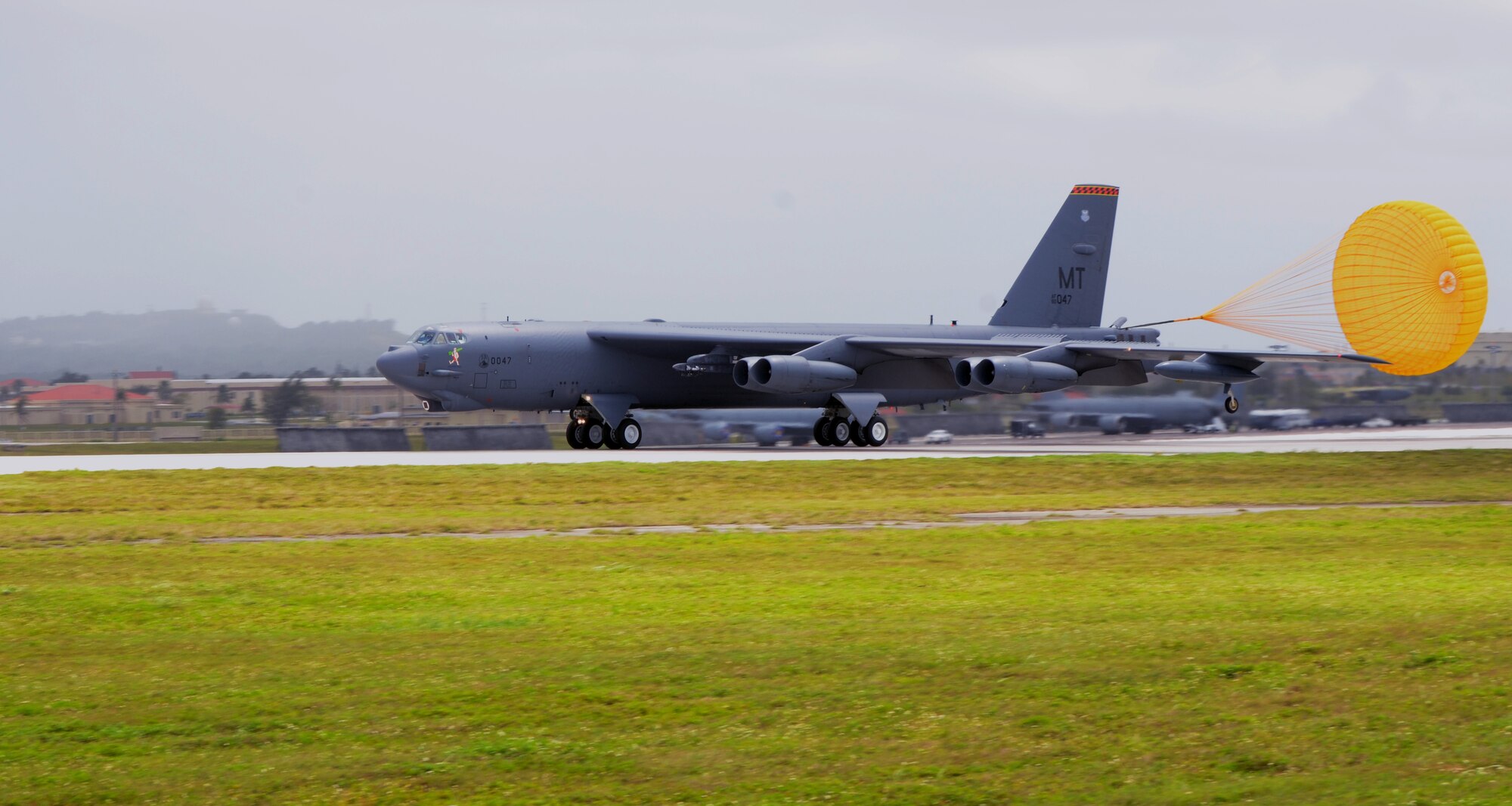 A B-52 Stratofortress from the 23rd Expeditionary Bomb Squadron, deployed from Minot Air Force Base, N.D., lands at Andersen AFB, Guam, April 2, 2013. The 23rd EBS arrived March 31 in relief of the 96th EBS from Barksdale AFB, La. and is deployed to Andersen to support U.S. Pacific Command’s continuous bomber presence mission. (U.S. Air Force photo by Senior Airman Benjamin Wiseman/Released)
