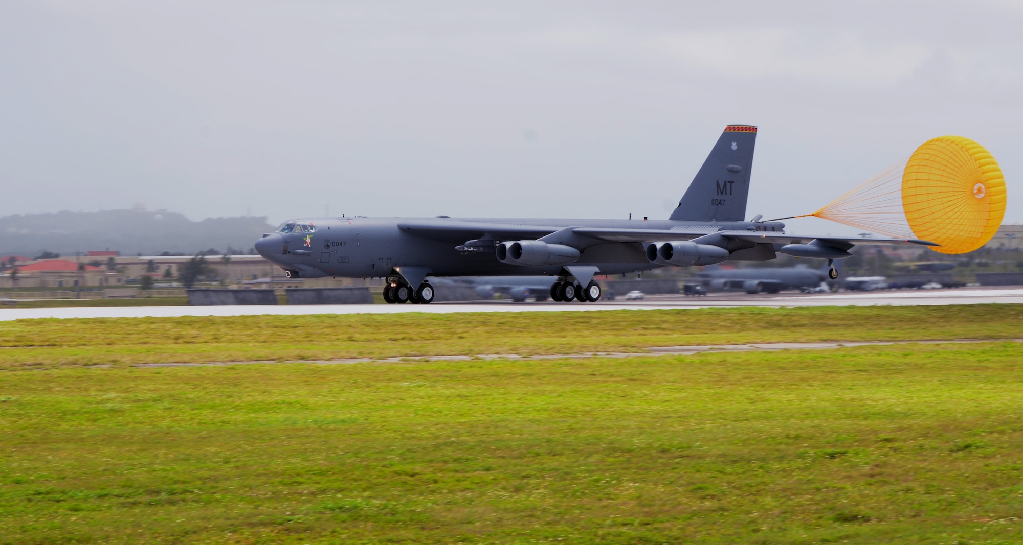 A B-52 Stratofortress from the 23rd Expeditionary Bomb Squadron, deployed from Minot Air Force Base, N.D., lands at Andersen AFB, Guam, April 2, 2013. The 23rd EBS arrived March 31 in relief of the 96th EBS from Barksdale AFB, La. and is deployed to Andersen to support U.S. Pacific Command’s continuous bomber presence mission. (U.S. Air Force photo by Senior Airman Benjamin Wiseman/Released)