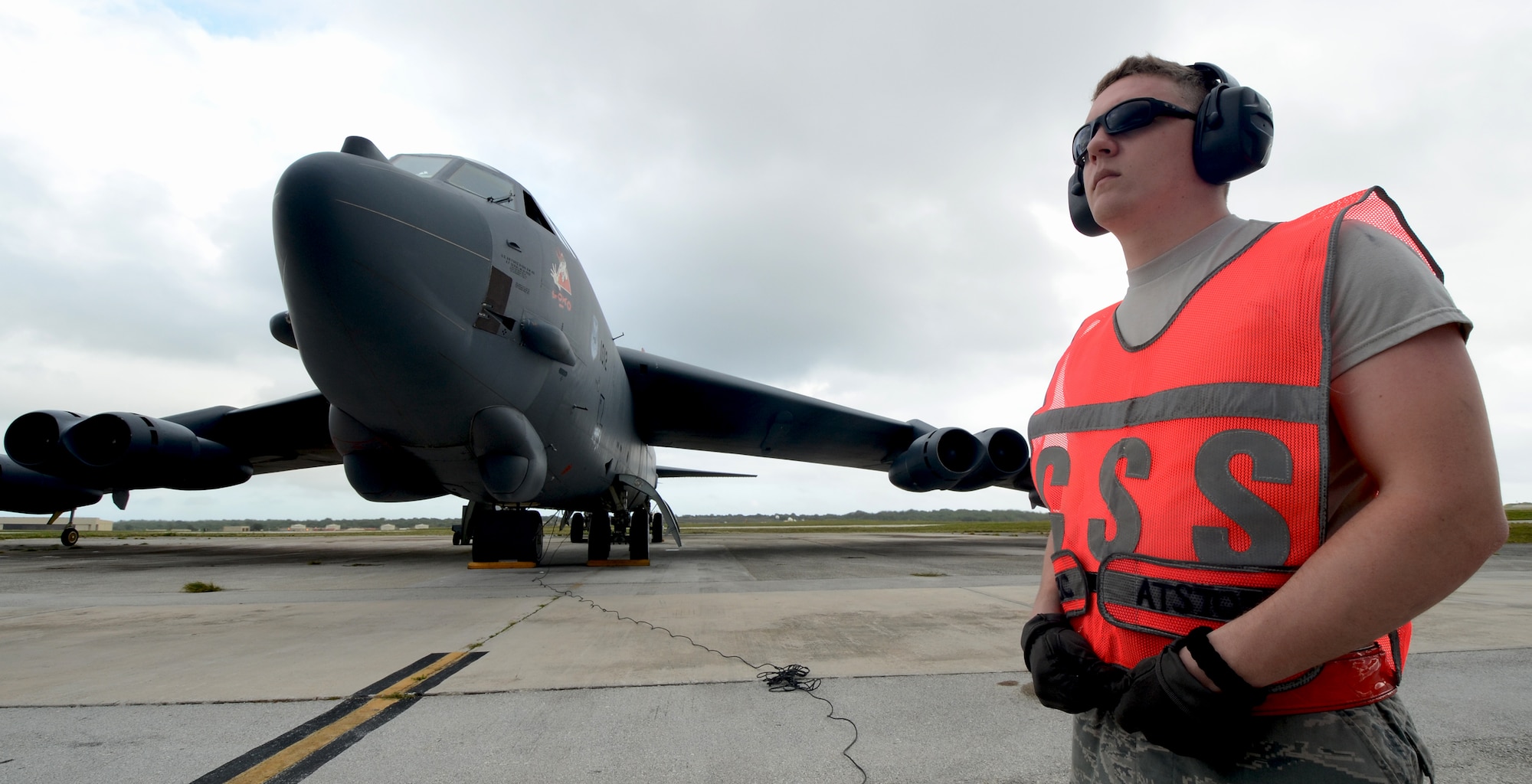 Airman 1st Class Kevin Carmel, 36th Expeditionary Aircraft Maintenance Squadron crew chief, deployed from Minot Air Force Base, N.D., prepares a B-52 Stratofortress for takeoff at Andersen Air Force Base, Guam, April 2, 2013. A new rotation of aircrews, maintenance personnel and aircraft arrived to Guam March 31 to replace the 96th Expeditionary Bomb Squadron in support of U.S. Pacific Command’s continuous bomber presence mission. (U.S. Air Force photo by Senior Airman Benjamin Wiseman/Released)