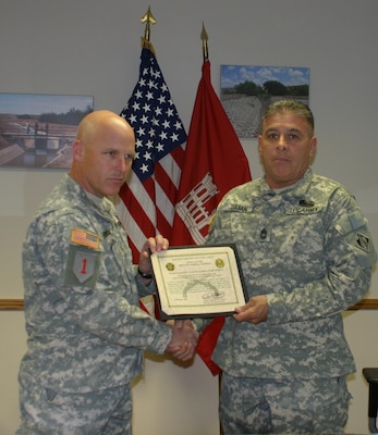 Master Sgt. Bernie Lujan receives the 2012 U.S. Army Antiterrorism Honor Roll Award at the Albuquerque District’s Headquarters March 26, 2013.