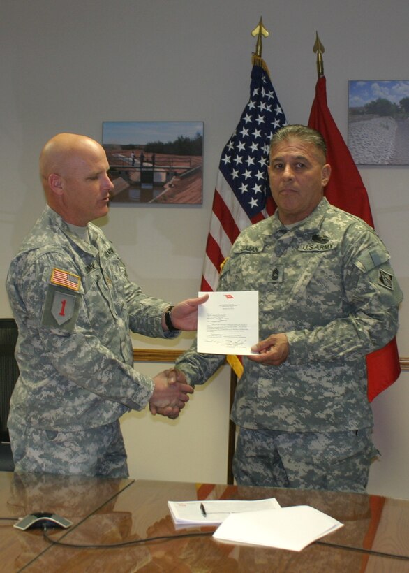 Master Sgt. Bernie Lujan receives the 2012 USACE Meritorious Antiterrorism Honor Roll Award at the Albuquerque District's Headquarters March 26, 2013.
