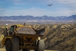 Col. Christopher C. Seymour, Marine Aircraft Group 26 commanding officer and Lt. Col. Patrick R. Hittle, Marine Wing Support Squadron 272 commanding officer, Marine Corps Air Station New River, N.C., conduct a flyover in an MV-22B Osprey to observe their Marines building and improving roads along the U.S./ Mexico border in Arizona, Mar. 19