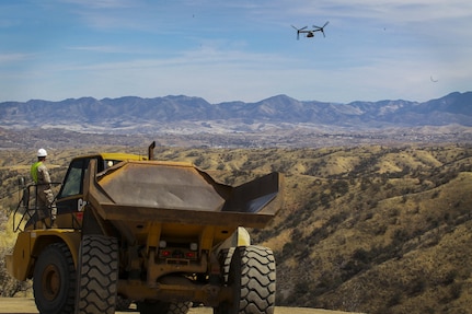 Col. Christopher C. Seymour, Marine Aircraft Group 26 commanding officer and Lt. Col. Patrick R. Hittle, Marine Wing Support Squadron 272 commanding officer, Marine Corps Air Station New River, N.C., conduct a flyover in an MV-22B Osprey to observe their Marines building and improving roads along the U.S./ Mexico border in Arizona, Mar. 19