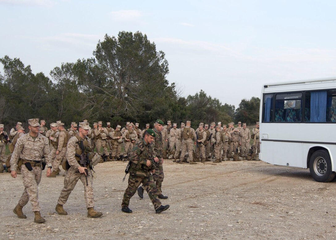 U.S. Marines and Sailors assigned to India Company, Battalion Landing Team 3/2, 26th Marine Expeditionary Unit (MEU), arrive at Le Camp Des Garrigues, Nimes, France, March 25, 2013. The 26th MEU is deployed to the 6th Fleet area of operation. The MEU operates continuously across the globe, providing the president and unified combatant commanders with a forward-deployed, sea-based, quick-reaction force. The MEU is a Marine Air-Ground Task Force capable of conducting amphibious operations, crisis-response and limited contingency operations. (U.S. Marine Corps photo by Cpl. Kyle N. Runnels/Released)