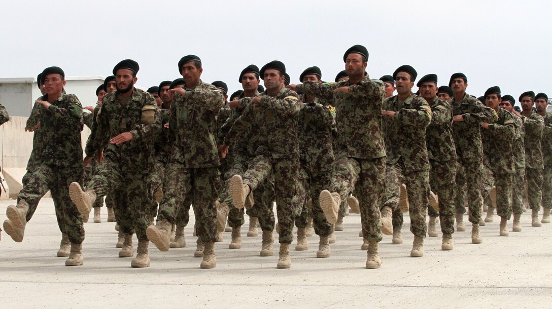 Soldiers with the Afghan National Army 215th Corps march during a graduation ceremony Mar. 28, here. More than 200 soldiers graduated after nine weeks of basic training and will move on to specialty schools. The 215th Corps is comprised of four brigades spread throughout Helmand province. (U.S. Marine Corps photo by GySgt. Joshua S. Higgins)