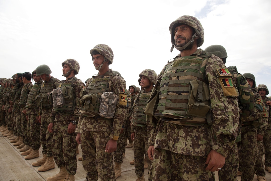 Afghan National Army (ANA) soldiers assigned to the 215th Corps participate in a graduation ceremony on Camp Shorabak, Helmand province, Afghanistan, March 28, 2013. The graduation ceremony was being held for the approximately 700 ANA soldiers graduating from the basic warrior course. (U.S. Marine Corps photo by Cpl. Alejandro Pena/Released)