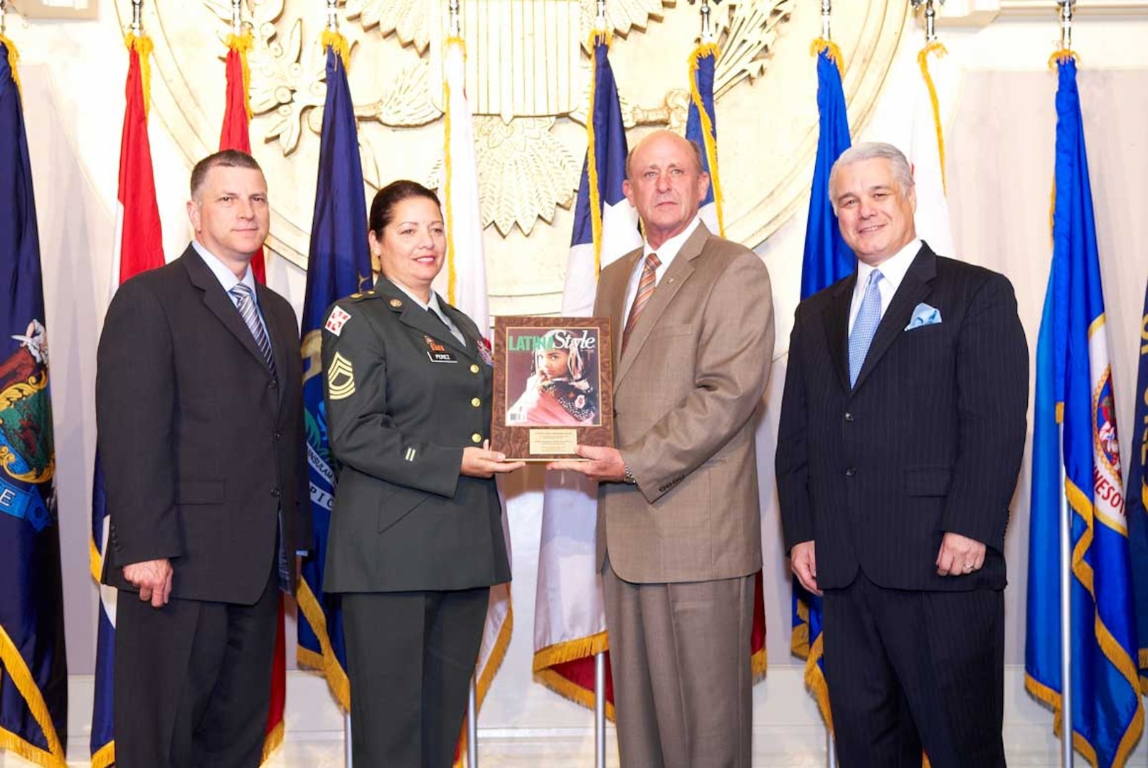 Army National Guard Master Sgt. Katherine Perez was recently presented a Meritorious Service in the Global War on Terror Award by LATINA Style magazine. Perez is a public affairs specialist for the National Guard Bureau's Office of Public Affairs and Strategic Communications. Presenting the award were, from left, Michael Dominguez, principal deputy under secretary of Defense for Personnel and Readiness, National Guard Bureau Assistant Chief Christopher Gardner, and Robert Bard, president and CEO of LATINA Style Magazine.