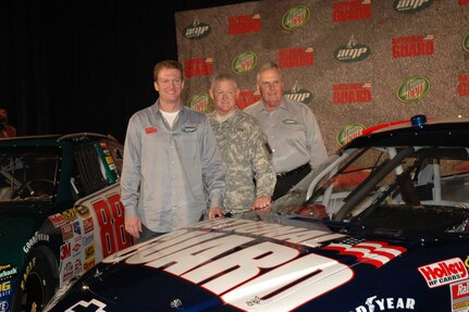 Dale Earnhardt Jr., left, will drive the National Guard car next year in NASCARS's top-level Sprint Cup series for Hendrick Motorsports. He stood with Lt. Gen. Clyde Vaughn, director of the Army National Guard, and Rick Hendrick, Hendrick Motorsports owner, in Dallas where the announcement was made on Sept. 19.