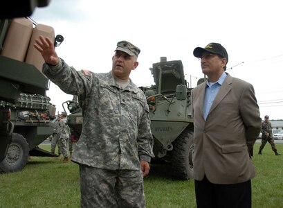 Lt. Col. Marc Ferraro, brigade commander, 56th Stryker Brigade Combat Team, Pennsylvania Army National Guard, briefs a member of the Pakistani military delegation on features and benefits of the Stryker vehicle Sept. 14.