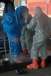 Members of the 32nd Civil Support Team of the Maryland National Guard suit up and perform simulated hazardous material recovery operations during Exercise Vigilant Guard Sept. 7 in downtown Baltimore.