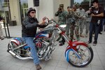 Paul Teutul Sr., of Orange County Choppers fame, rides the National Guard's "Patriot Chopper" in front of the Army National Guard Readiness Center in Arlington, Va., during a Sept. 27 unveiling ceremony.