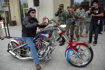 Paul Teutul Sr., of Orange County Choppers fame, rides the National Guard's "Patriot Chopper" in front of the Army National Guard Readiness Center in Arlington, Va., during a Sept. 27 unveiling ceremony.