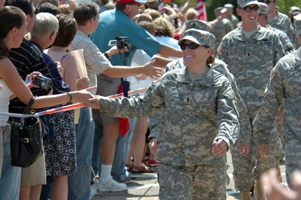 Family and friends greet U.S. Army Soldiers from Charlie Company, 1st Brigade Combat Team, 34th Infantry Division as they arrive at the Cottage Grove Armory in Minnesota July 16, 2007. Minnesota National Guard's 1st Brigade Combat Team has been deployed for 22 months with 16 months out of the deployment in a combat zone.