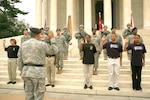 Vice Chief of Staff of the Army Gen. Richard Cody swears in new Army recruits in a ceremony at the Jefferson Memorial in Washington. On the far right, new Soldiers Paul Stuart of Fairfax, Va., and Erika Hanberry of Virginia Beach, Va., represent the Army National Guard.
