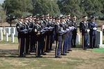 Army honor guard Soldiers hold 12 folded American flags during an interment ceremony at Arlington National Cemetery Oct. 10 for 12 Soldiers killed in Iraq 10 months ago. The Soldiers, 10 from the Army National Guard and two from the active duty Army, were killed northeast of Baghdad when their UH-60 Black Hawk helicopter was shot down.