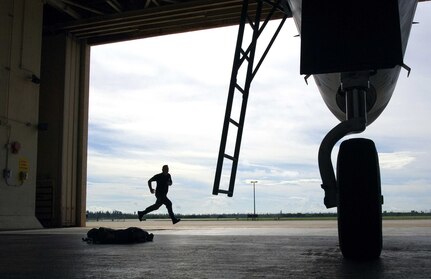 Crew chief Staff Sgt. Thomas Fitzgerald sprints to his F-15 Eagle after an alert alarm announces the immediate launch of aircraft during a training exercise for Operation Noble Eagle Oct. 3 at the 125th Fighter Wing, Det. 1, Homestead Air Reserve Base, Fla. The detachment provides the Continental NORAD Region commander rapid response to invasion of the sovereign airspace of the U.S., and responds with appropriate defense measures against all hostile actions directed at the people and property of the U.S. during Operation Noble Eagle.