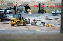 "Dirt boys" from the 474th Expeditionary Civil Engineering Squadron prepare to lay a permanent foundation for the Expeditionary Legal Complex which will house Military Commissions proceedings at Guantanamo Bay once they are resumed pending court review.